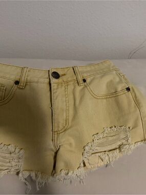 High-Rise Yellow Distressed Denim Shorts